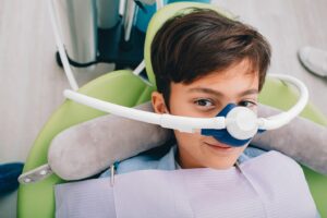 Young boy receiving nitrous oxide through nasal mask.